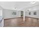 Expansive living room with hardwood floors, neutral paint, and a striking stone fireplace feature at 3640 Silver Leaf Sw Ln, Marietta, GA 30008
