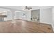 Open-concept living room boasts hardwood floors, modern lighting, and a beautiful stone fireplace at 3640 Silver Leaf Sw Ln, Marietta, GA 30008