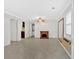 Living room features tile flooring, a brick fireplace, and access to a kitchen and laundry area at 3640 Silver Leaf Sw Ln, Marietta, GA 30008