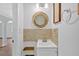 Stylish powder room with decorative mirror, modern sink, and elegant tile backsplash at 3640 Silver Leaf Sw Ln, Marietta, GA 30008