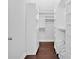 Spacious walk-in closet with custom shelving and storage solutions at 3640 Silver Leaf Sw Ln, Marietta, GA 30008