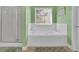 Bright bathroom with a white bathtub under a window and a glass shower door at 917 Redstone Trl, Dacula, GA 30019