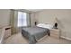 Comfortable bedroom featuring a plush bed, matching nightstands, and soft neutral tones at 917 Redstone Trl, Dacula, GA 30019