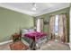 Comfortable bedroom with green walls, large windows, and a cozy rug at 917 Redstone Trl, Dacula, GA 30019