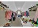Spacious walk-in closet featuring ample shelving and storage options for organization at 917 Redstone Trl, Dacula, GA 30019