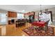 Eat-in kitchen with warm wood cabinets, a center island, and an adjacent dining area at 917 Redstone Trl, Dacula, GA 30019