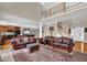 Inviting living room with soaring ceiling, a staircase with white railings, and gleaming hardwood floors at 917 Redstone Trl, Dacula, GA 30019