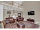 Spacious living room with a soaring ceiling, a staircase with white railings, and a comfortable seating area at 917 Redstone Trl, Dacula, GA 30019