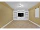 Inviting living room with built-in shelves, modern lighting, and neutral walls at 917 Redstone Trl, Dacula, GA 30019