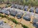 Aerial view of fenced backyards in a residential neighborhood, featuring a pergola covered outdoor seating area at 11395 Crestview Ter, Johns Creek, GA 30024