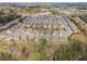 An aerial view showcases a well-planned community with manicured lawns and attractive homes at 11395 Crestview Ter, Johns Creek, GA 30024