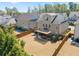 Aerial view of backyard showcasing a wooden pergola, lush lawn, and perimeter fence at 11395 Crestview Ter, Johns Creek, GA 30024