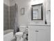 Bathroom featuring a shower over tub, a toilet, and a light gray sink vanity at 11395 Crestview Ter, Johns Creek, GA 30024