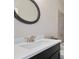 Bathroom featuring a shower over tub and a sink vanity with a dark cabinet at 11395 Crestview Ter, Johns Creek, GA 30024