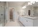 Elegant bathroom with double vanity, walk-in shower, and tile flooring at 11395 Crestview Ter, Johns Creek, GA 30024