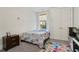 Cozy bedroom featuring a colorful rug, window, and closet at 11395 Crestview Ter, Johns Creek, GA 30024