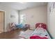 Adorable bedroom featuring a twin bed, desk, wood floors, and natural light at 11395 Crestview Ter, Johns Creek, GA 30024