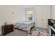 Bedroom featuring carpet flooring, a twin bed, and closet with folding doors at 11395 Crestview Ter, Johns Creek, GA 30024