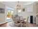 Bright breakfast nook with a view of the backyard, a modern light fixture, and space for a small table at 11395 Crestview Ter, Johns Creek, GA 30024