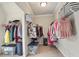 Walk-in closet with ample storage space features metal shelving and rods for clothes at 11395 Crestview Ter, Johns Creek, GA 30024