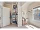 Spacious closet area with built-in shelving, a window, and ample space for organizing clothes and accessories at 11395 Crestview Ter, Johns Creek, GA 30024