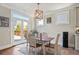 Dining area featuring hardwood floors and large french doors to the backyard at 11395 Crestview Ter, Johns Creek, GA 30024