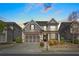 Beautiful two-story home with a two-car garage, landscaped front yard, and welcoming entrance at 11395 Crestview Ter, Johns Creek, GA 30024