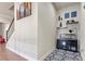 Hallway with stairway, art and decor including an aquarium at 11395 Crestview Ter, Johns Creek, GA 30024