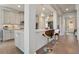 Spacious open kitchen featuring a breakfast bar, stainless appliances, and gray cabinetry at 11395 Crestview Ter, Johns Creek, GA 30024
