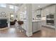 Spacious kitchen island bar with stainless steel appliances and hardwood floors at 11395 Crestview Ter, Johns Creek, GA 30024
