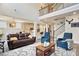 Bright open concept living room featuring a soaring ceiling, hardwood floors, and cozy furniture at 11395 Crestview Ter, Johns Creek, GA 30024