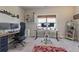 Well-lit office featuring two desks, multiple monitors, and comfortable chairs at 11395 Crestview Ter, Johns Creek, GA 30024