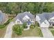 Aerial view of the house showcasing its well-manicured lawn, landscaping, and inviting curb appeal at 1718 Autumn Sage Dr, Dacula, GA 30019