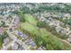 Aerial view showcasing the neighborhood, golf course, and the property's prime location at 1718 Autumn Sage Dr, Dacula, GA 30019