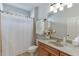 This bathroom features a sink and shower with neutral decor at 1718 Autumn Sage Dr, Dacula, GA 30019