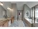 This bathroom features dual sinks, a bathtub and a closet at 1718 Autumn Sage Dr, Dacula, GA 30019
