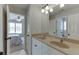 Bright bathroom featuring a double vanity with granite countertops at 1718 Autumn Sage Dr, Dacula, GA 30019