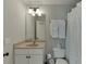 Bright bathroom featuring a vanity with a tan countertop and a neutral colored tile floor at 1718 Autumn Sage Dr, Dacula, GA 30019