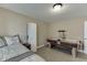 Inviting carpeted bedroom with a bed, wardrobe, table, and an air hockey table at 1718 Autumn Sage Dr, Dacula, GA 30019
