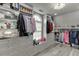 Bright walk-in closet featuring custom shelving and hanging storage at 1718 Autumn Sage Dr, Dacula, GA 30019