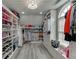 Walk-in closet with custom shelving, drawers, and ample storage space at 1718 Autumn Sage Dr, Dacula, GA 30019