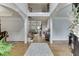 Elegant foyer featuring hardwood floors, arched doorways, and a staircase leading to the upper level at 1718 Autumn Sage Dr, Dacula, GA 30019