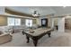 Expansive finished basement featuring a billiards table, comfortable seating, and recessed lighting at 1718 Autumn Sage Dr, Dacula, GA 30019