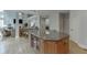 The large island with breakfast bar provides additional counter space and seating in this kitchen at 1718 Autumn Sage Dr, Dacula, GA 30019