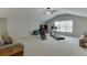 Spacious room with vaulted ceiling, large window, exercise equipment, and neutral carpet at 1718 Autumn Sage Dr, Dacula, GA 30019