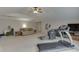 Large room with vaulted ceiling, an exercise machine, comfortable seating, and neutral carpet at 1718 Autumn Sage Dr, Dacula, GA 30019