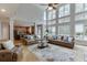 Spacious living room with soaring ceilings, large windows, and an open layout, perfect for entertaining at 1718 Autumn Sage Dr, Dacula, GA 30019
