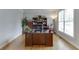 Office with a large desk, bookshelves, and a window that provides natural light at 1718 Autumn Sage Dr, Dacula, GA 30019