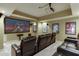 Basement theater room featuring comfortable leather recliners and a large projection screen at 1718 Autumn Sage Dr, Dacula, GA 30019