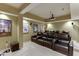 Basement theater room featuring comfortable leather recliners, a large projector screen, and wall art at 1718 Autumn Sage Dr, Dacula, GA 30019